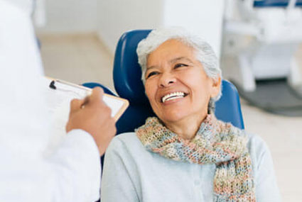 woman smiling in dental chair